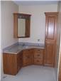 Red oak cabinets - Raised panel doors - Standard overlay style - Cutured marble countertop with an integral sink