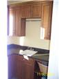 Maple cabinets - Laminate countertop - Clothes rod
