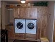 Rustic hickory cabinets - Wood drawers under the washer and dryer - Clothes rod