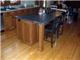 Island with a wood column under the countertop