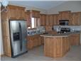 Red oak cabinets - Raised panel doors and side panels - Standard overlay style - Laminate countertops