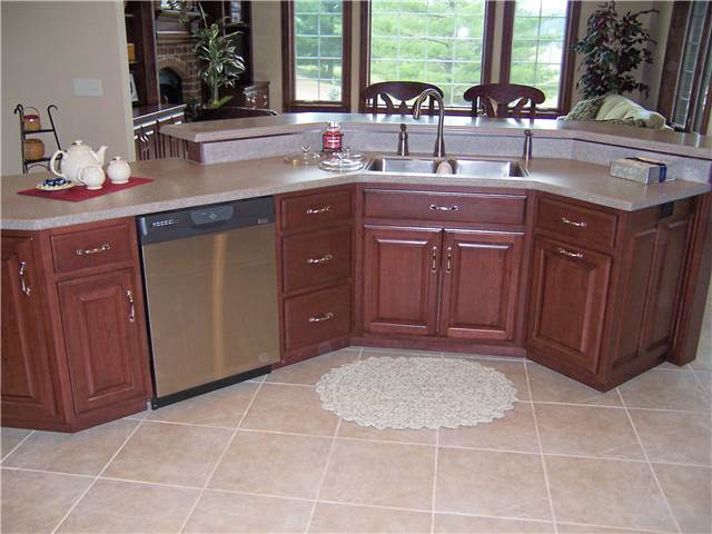 Solid surface, dual level island countertop with a stainless undermount sink
