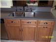 Corian solid surface countertop with a stainless undermount sink