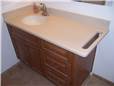 Corian solid surface countertop, undermount sink, and integral towelbar