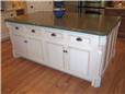 Painted and glazed island - Flat panel miter corner doors and drawer fronts - Standard overlay style - Corian solid surface countertop