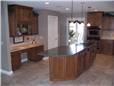 Maple cabinets - Flat panel doors and drawer fronts - Full overlay style - Corian solid surface countertops