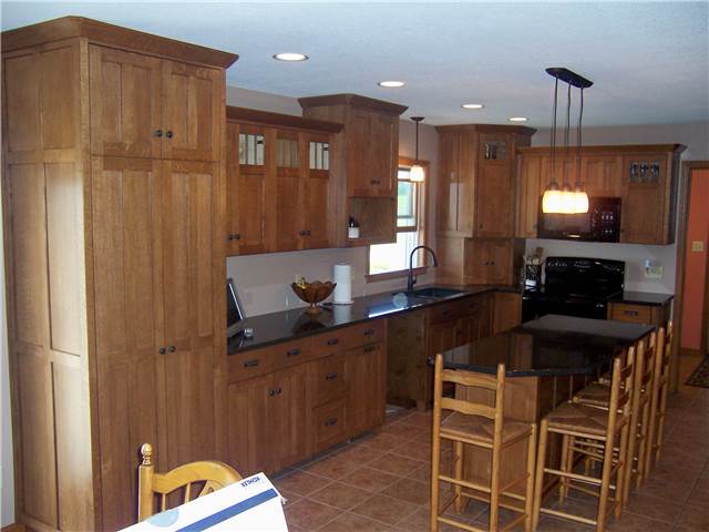 Quartersawn white oak cabinets - Flat panel doors - Full overlay style - Quartz countertops