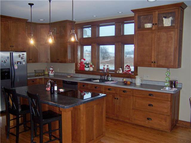 Quartersawn white oak cabinets - Flat panel doors, drawer fronts, and end panels - Full overlay style - Laminate countertops