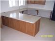 Small business office - oak cabinetry with laminate countertops