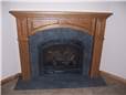 Fireplace mantel - stained oak with panels & fluting