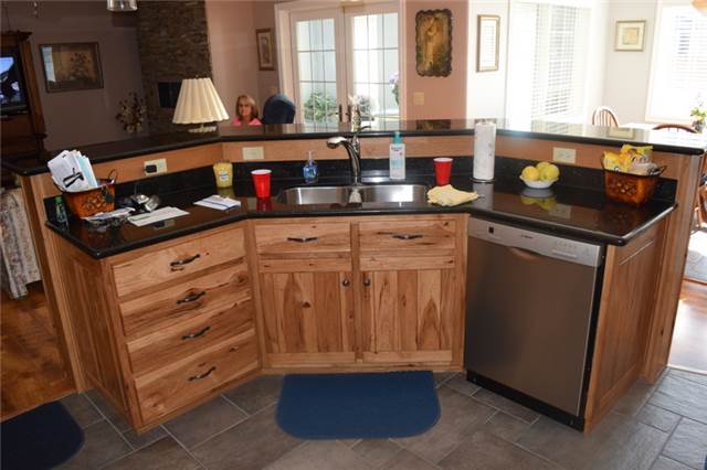 Rustic hickory island with a raised bar - granite countertops