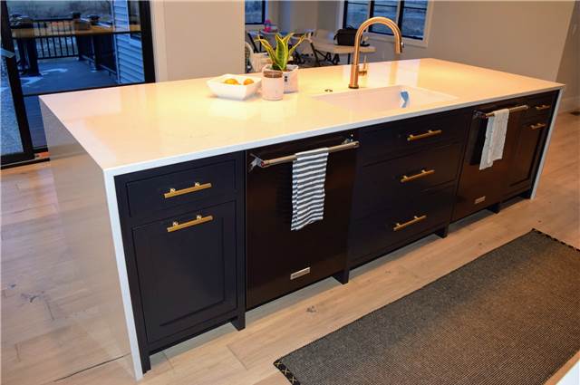 Painted island cabinets - Quartz countertop with waterfall ends
