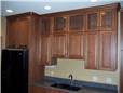 Hickory cabinets - Raised panel doors - Arts and Crafts glass doors - Full overlay style - Quartz countertop