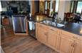 Stained & glazed maple island cabinets - honed granite countertops