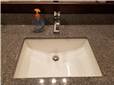 Cultured granite countertop with an undermount porcelain sink