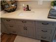 Painted cabinet with flat panel doors and drawer fronts - full overlay style - Quartz countertop