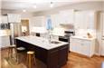 Painted perimeter cabinets - Stained rustic hickory island - Quartz countertops