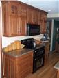 Hickory cabinets - Raised panel doors, drawer fronts, and side panels - Standard overlay style - Laminate countertops