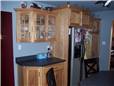 Rustic hickory cabinets - Flat panel doors - Standard overlay style - Laminate countertops