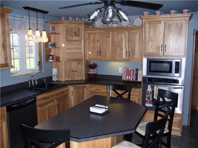 Rustic hickory cabinets - Flat panel doors - Standard overlay style - Laminate countertops