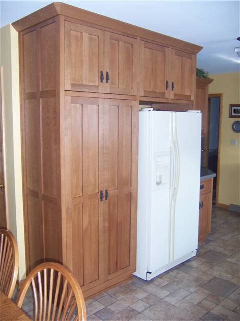 Quartersawn white oak cabinets - Flat panel doors, drawer fronts, and side panels - Inset style