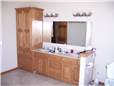 Red oak cabinets - Raised panel doors - Standard overlay style - Cultured marble countertop with integral sinks
