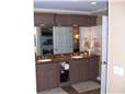 Painted cabinets - Raised panel doors - Standard overlay - Corian solid surface countertops with integral sinks