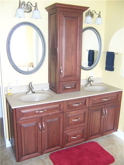 Poplar cabinets - Raised panel, miter corner doors and drawer fronts - Full overlay style - Cultured marble countertop with integral sinks