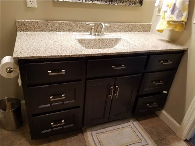 Dark stain cabinet - cultured granite countertop