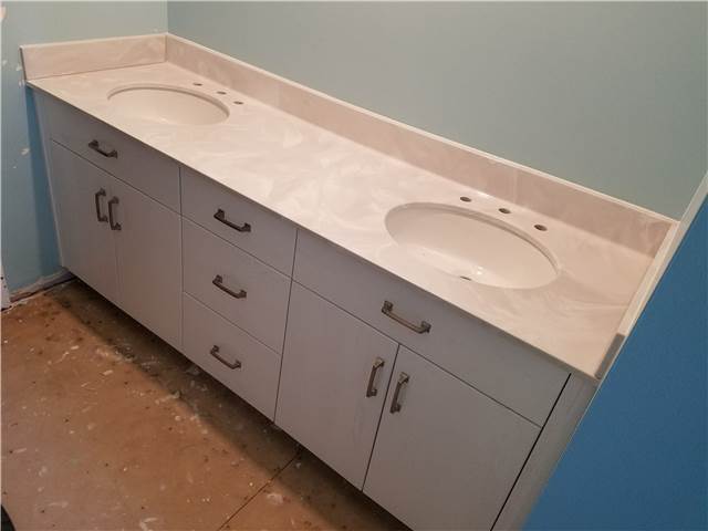 Slab front painted oak cabinet - full overlay style - Cultured marble countertop with undermount porcelain sinks