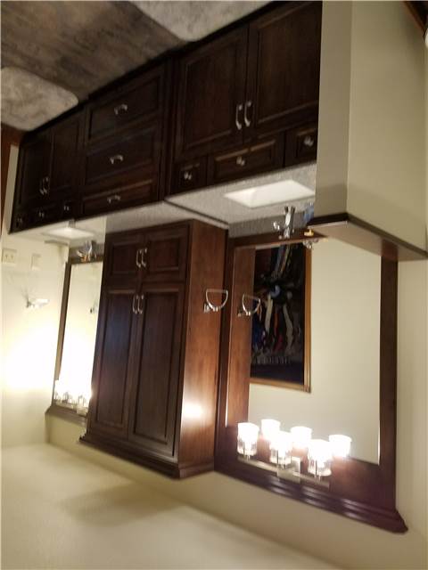 Stained hickory cabinets - cultured granite countertops with undermount porcelain sinks