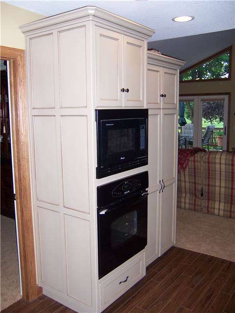 Tall cabinet with flat panel side