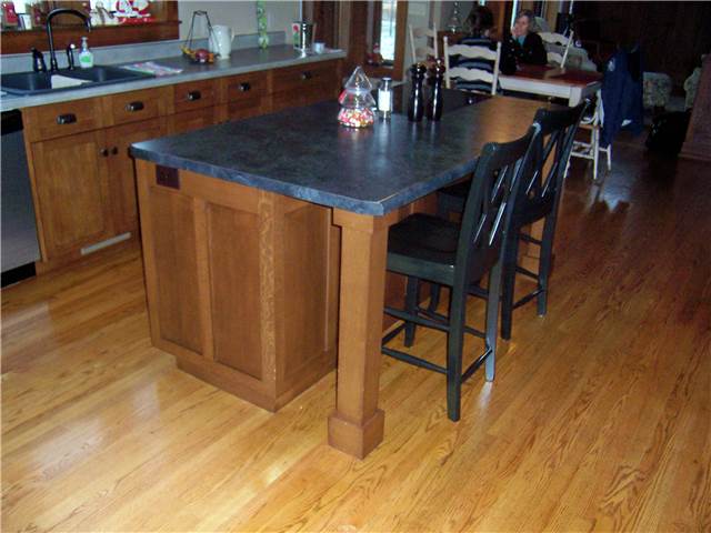 Island with a wood column under the countertop