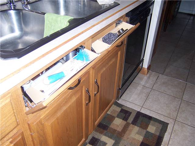 Tip-out sink front trays