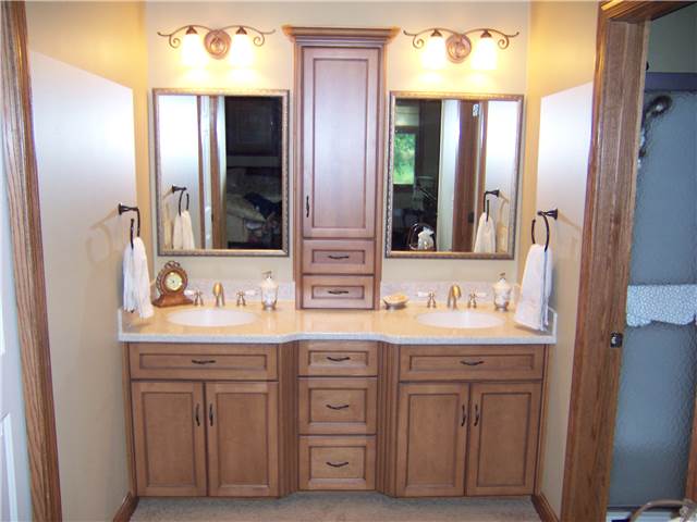 Maple cabinets stained and glazed - Flat panel doors and drawer fronts - Full overlay style - Corian solid surface countertop with integral sinks