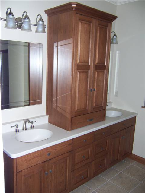 Hickory cabinets - Raised panel doors - Full overlay style - Corian solid surface countertop with integral sinks