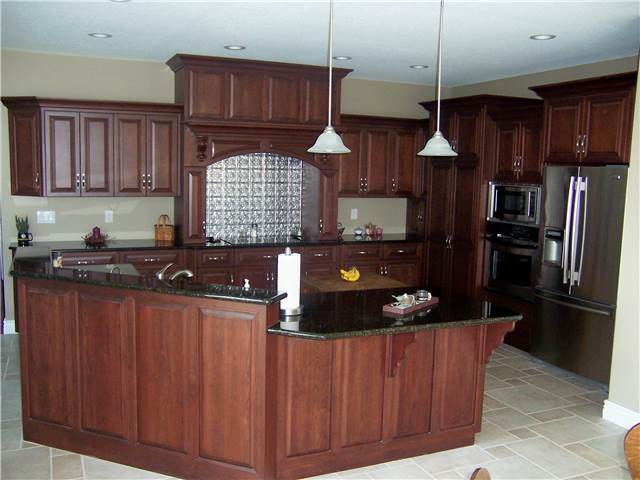 Cherry cabinets - Raised panel miter corner doors - Full overlay style - Granite countertops